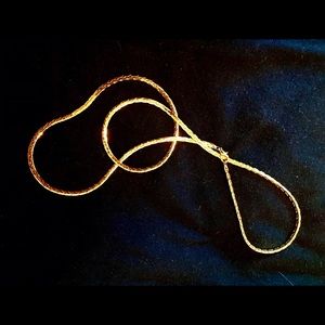 Striking Gold Tone 24” Serpentine Necklace